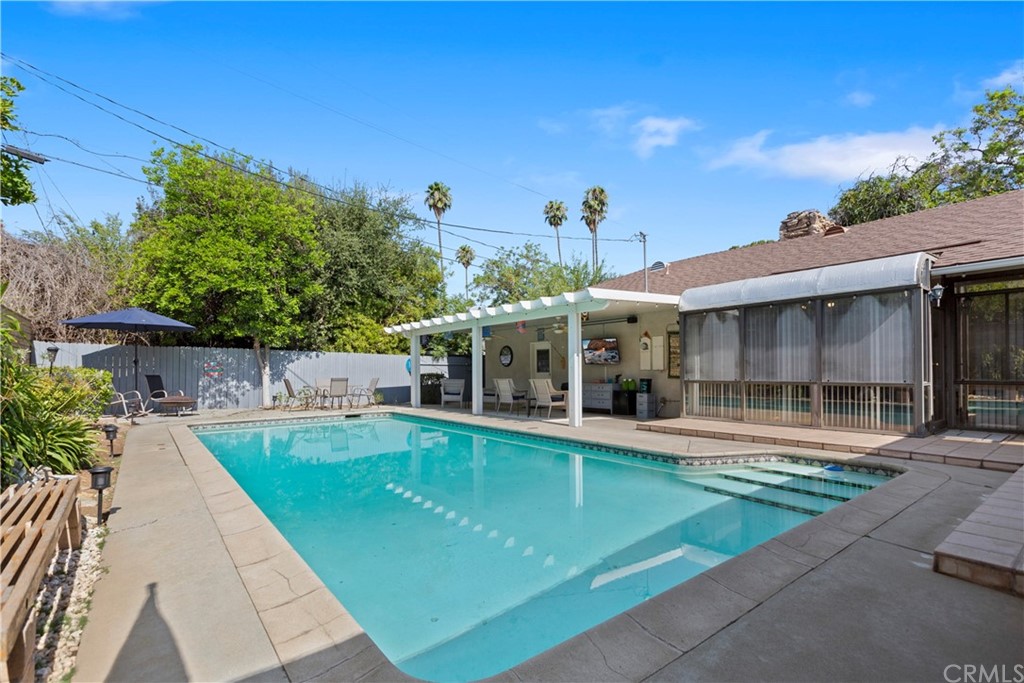 5201 Coventry Drive Riverside, CA 92506 - Photo 29 of 42 a view of a house with a swimming pool