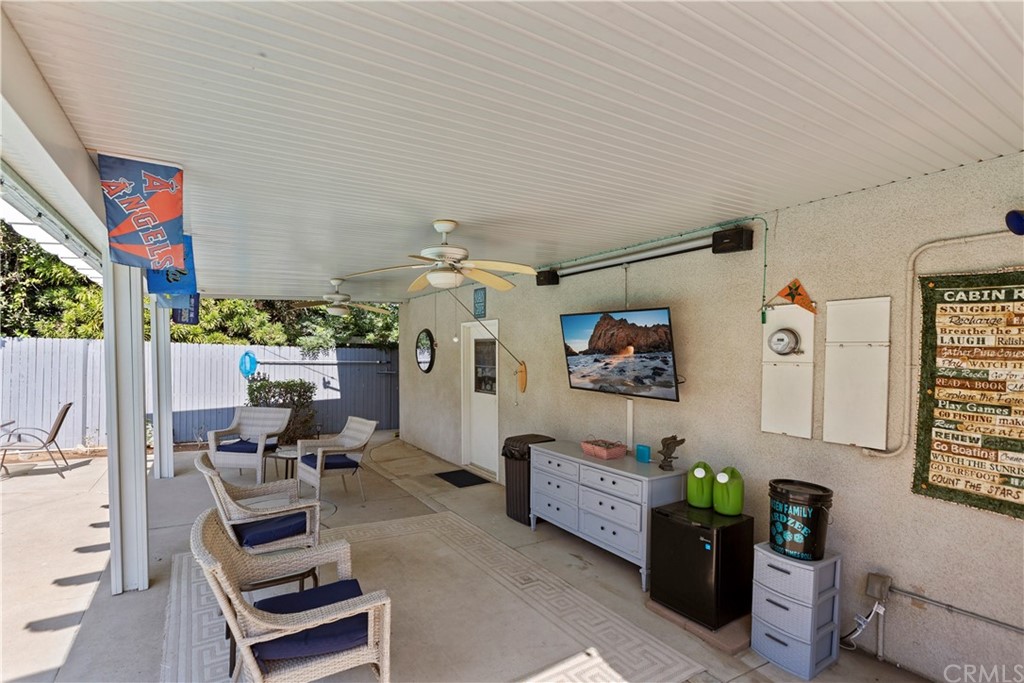 5201 Coventry Drive Riverside, CA 92506 - Photo 32 of 42 a living room with furniture and a flat screen tv