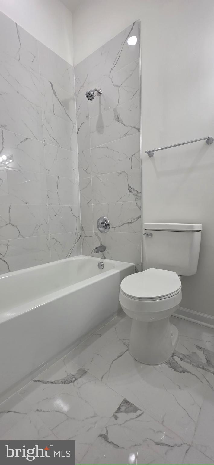 2233 North 16th Street Philadelphia, PA 19132 - Photo 12 of 27 a bathroom with a toilet and a bath tub
