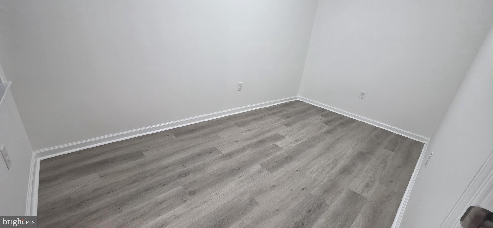 2233 North 16th Street Philadelphia, PA 19132 - Photo 14 of 27 an empty room with wooden floor