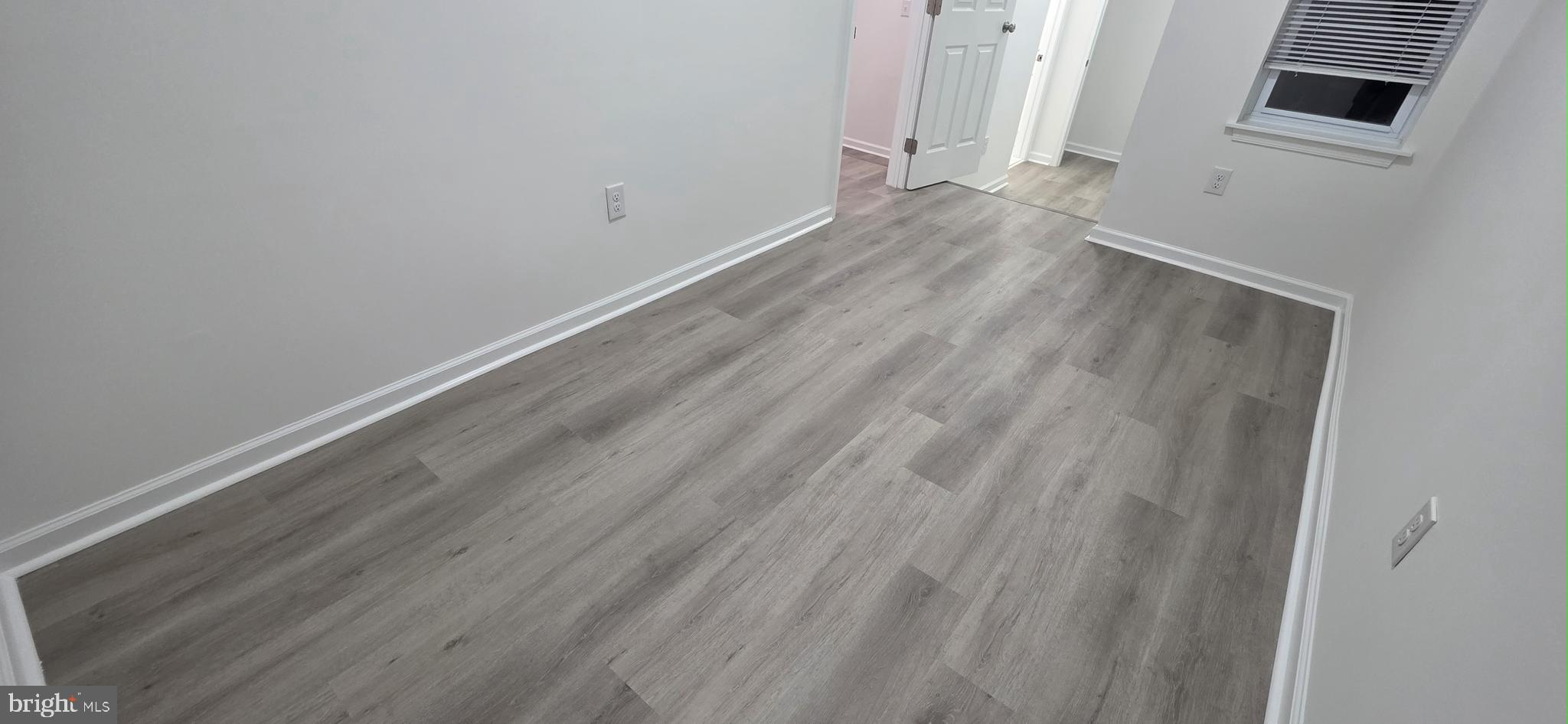 2233 North 16th Street Philadelphia, PA 19132 - Photo 16 of 27 a view of a room with wooden floor