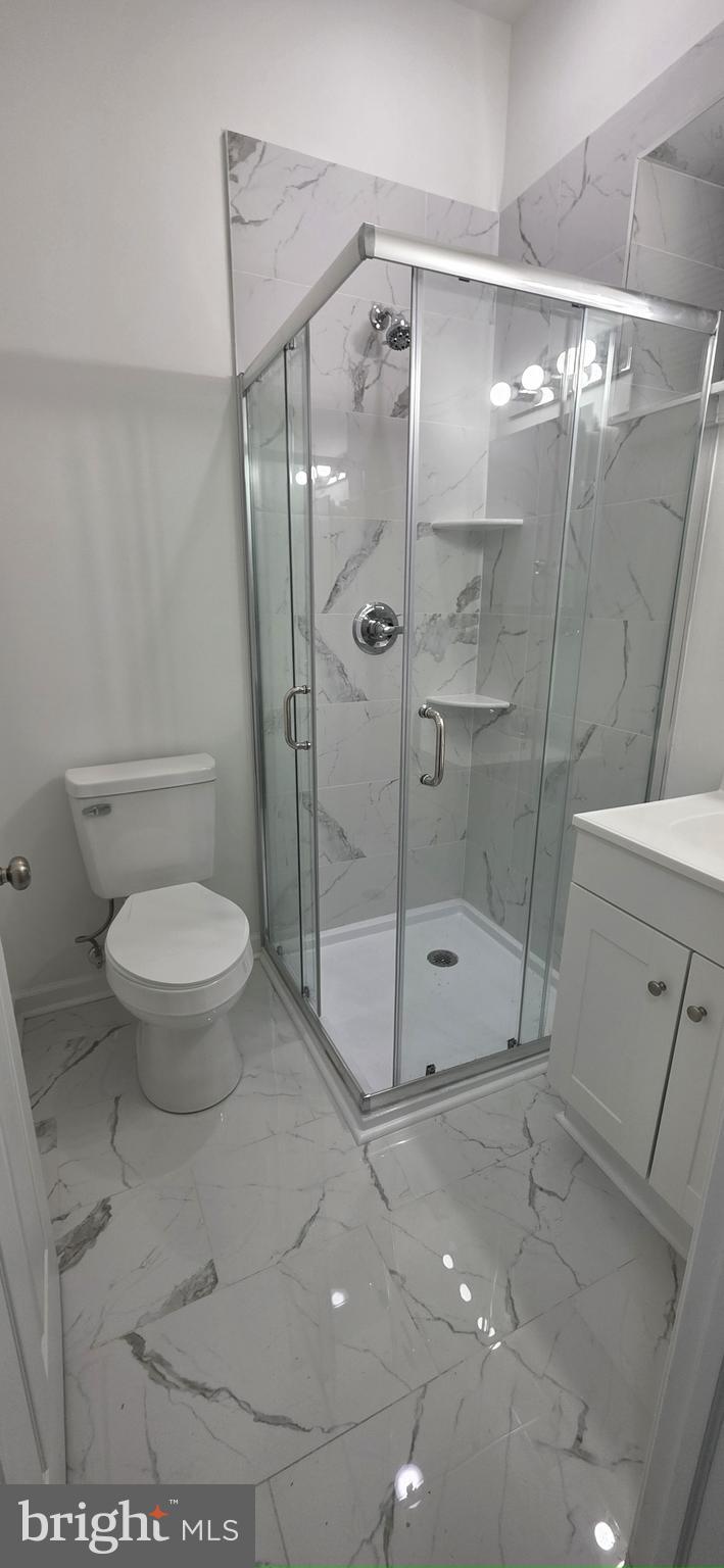 2233 North 16th Street Philadelphia, PA 19132 - Photo 19 of 27 a bathroom with a shower and a toilet