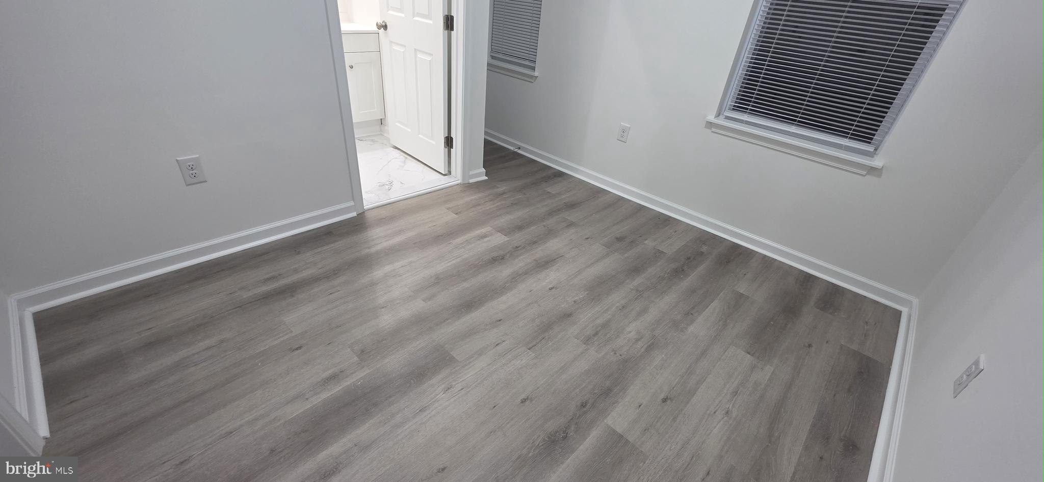 2233 North 16th Street Philadelphia, PA 19132 - Photo 22 of 27 a view of empty room with wooden floor