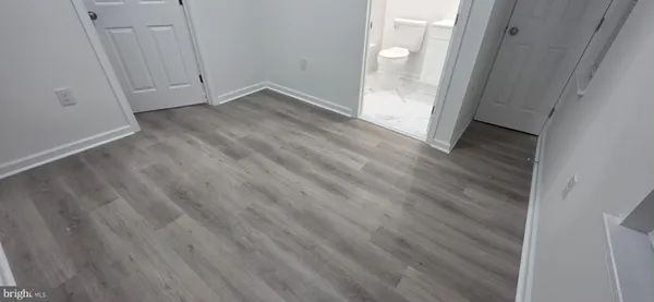 a bathroom with a toilet a sink and a bathtub