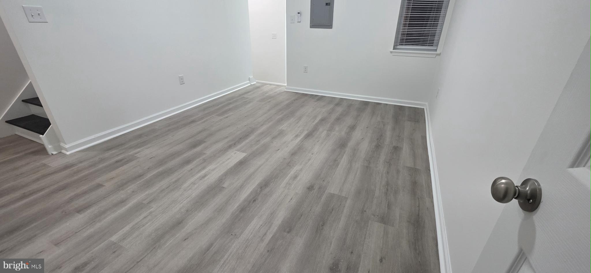 2233 North 16th Street Philadelphia, PA 19132 - Photo 6 of 27 a view of a room with wooden floor and windows