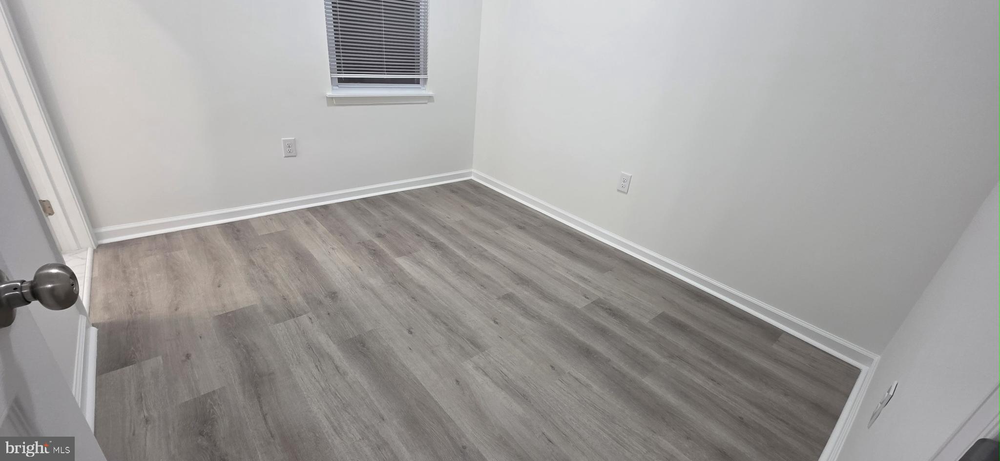2233 North 16th Street Philadelphia, PA 19132 - Photo 8 of 27 a view of a small space with wooden floor and a window