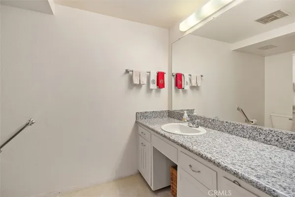 a bathroom with a toilet and a glass shower