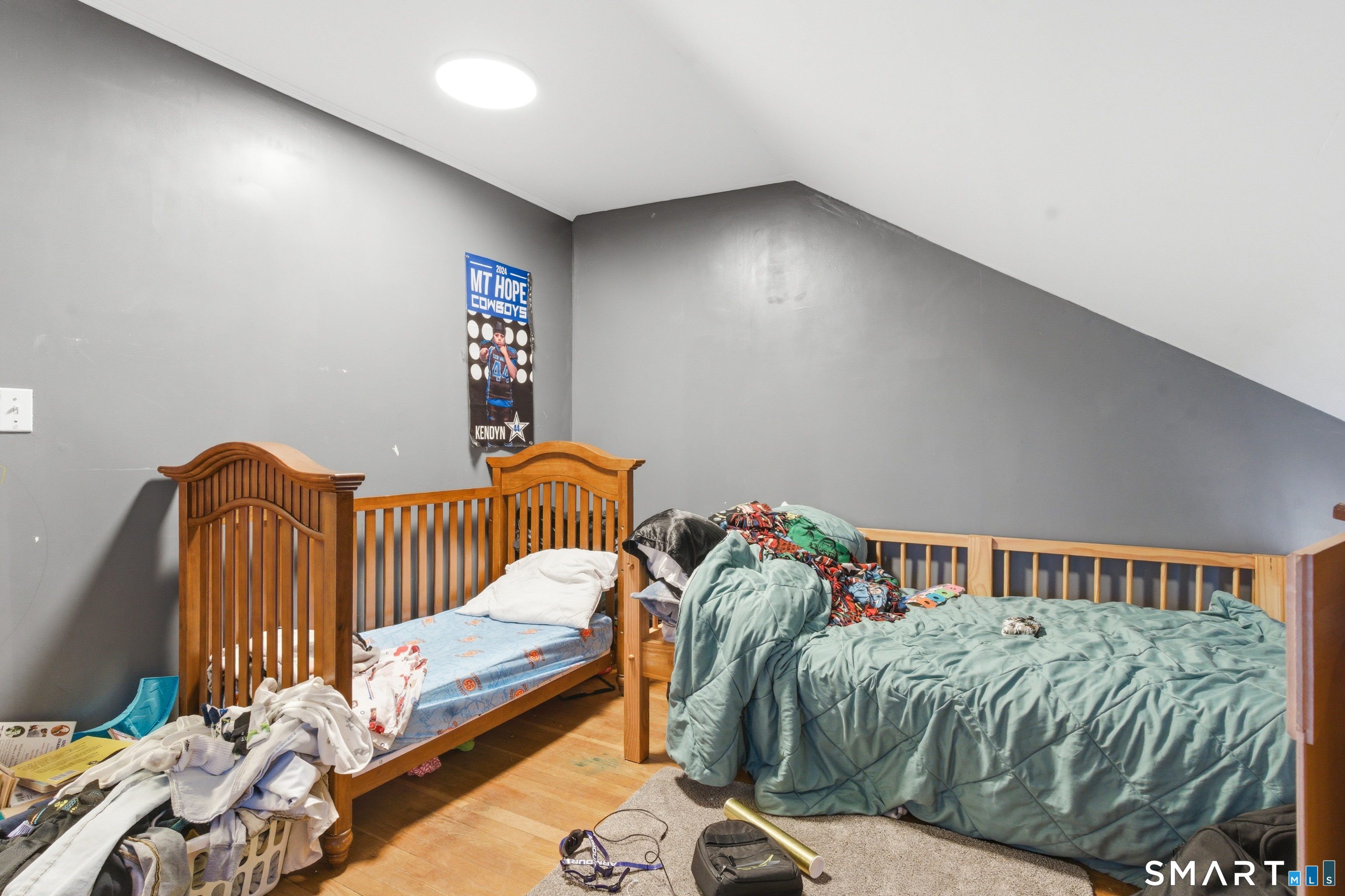 36 Church Street Killingly, CT 06241 - Photo 10 of 39 a bedroom with a bed and a window
