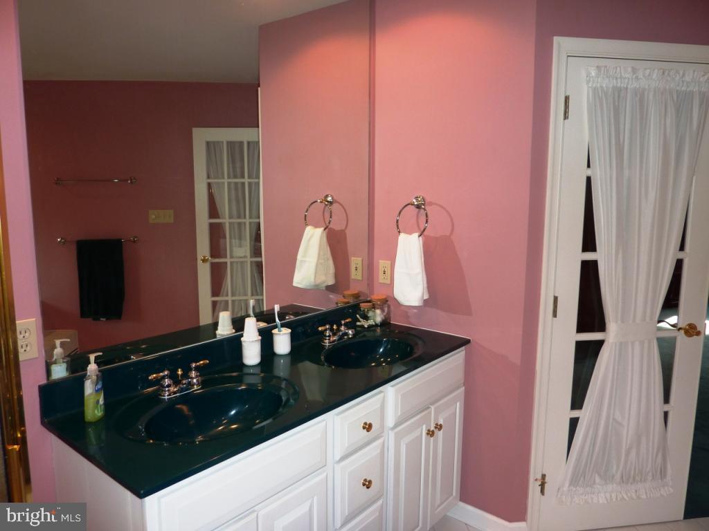 779 Power Road Manheim, PA 17545 - Photo 19 of 37 a bathroom with granite countertop a sink and a mirror