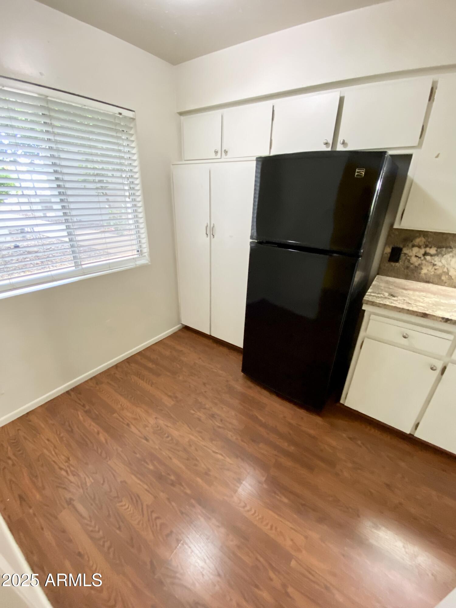 1107 West Osborn Road, Unit 113 Phoenix, AZ 85013 - Photo 3 of 20 a view of walk in closet with window
