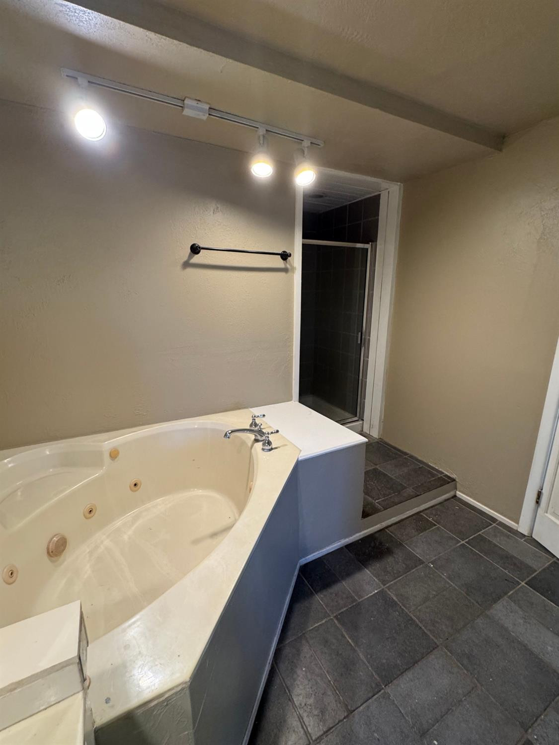3111 30th Street Lubbock, TX 79410 - Photo 11 of 12 a bathroom with a tub and a sink