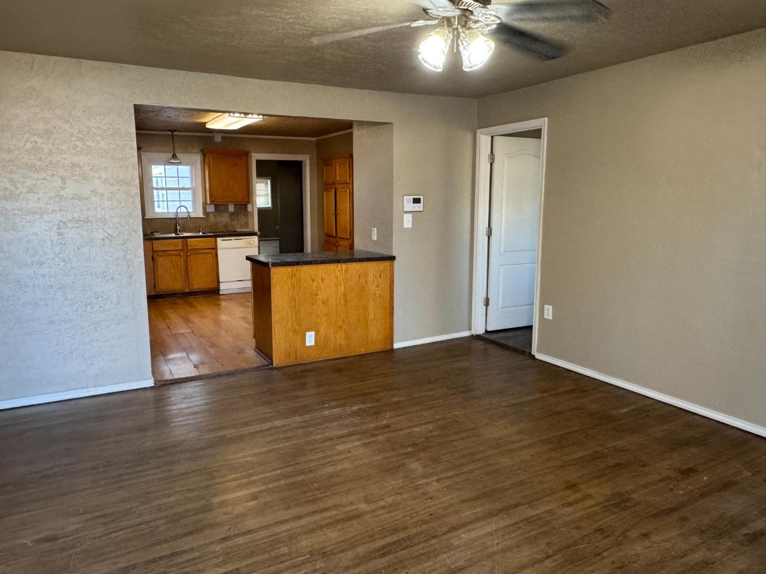 3111 30th Street Lubbock, TX 79410 - Photo 12 of 12 a view of a livingroom with a kitchen