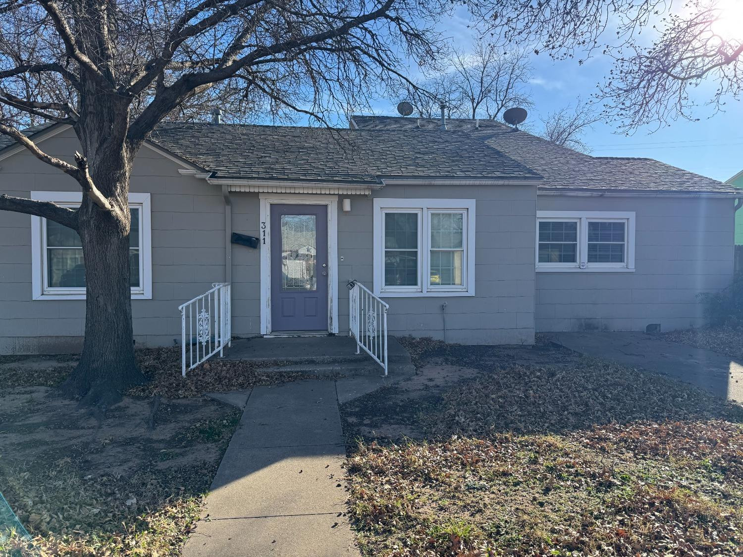3111 30th Street Lubbock, TX 79410 - Photo 3 of 12 a front view of a house with garden