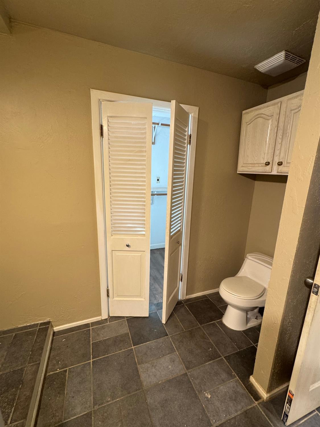 3111 30th Street Lubbock, TX 79410 - Photo 8 of 12 a bathroom with a toilet