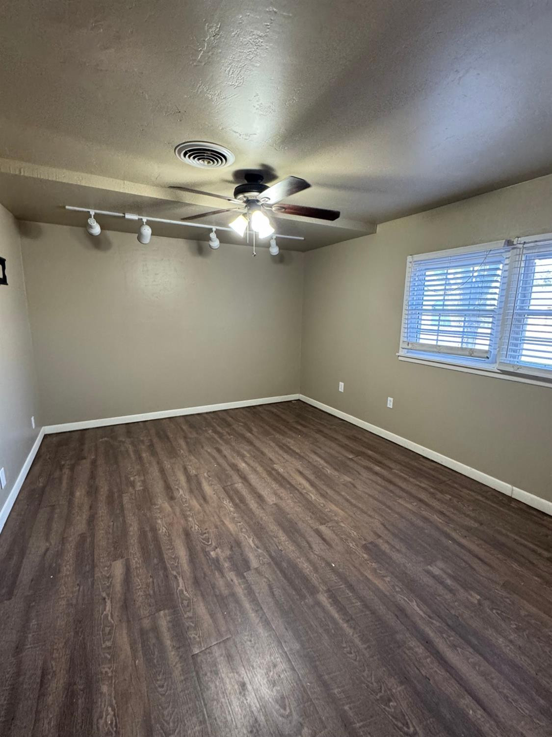 3111 30th Street Lubbock, TX 79410 - Photo 10 of 12 a view of a room with wooden floor