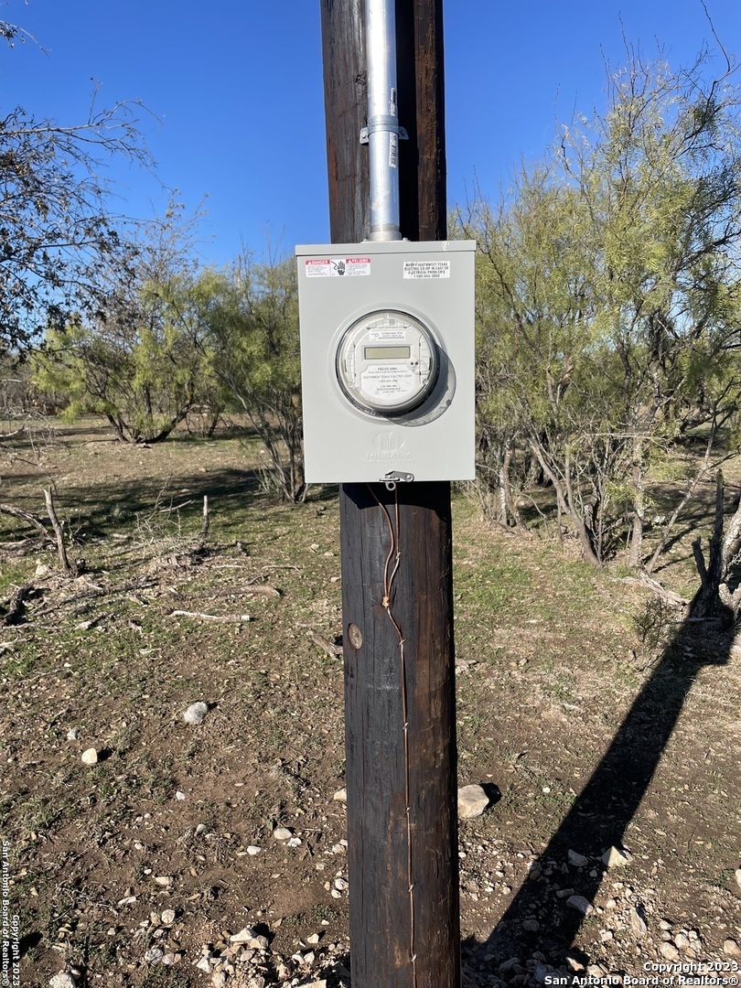 587 Valley Road Christoval, TX 76935 - Photo 7 of 41 a view of a pathway of a building with a yard