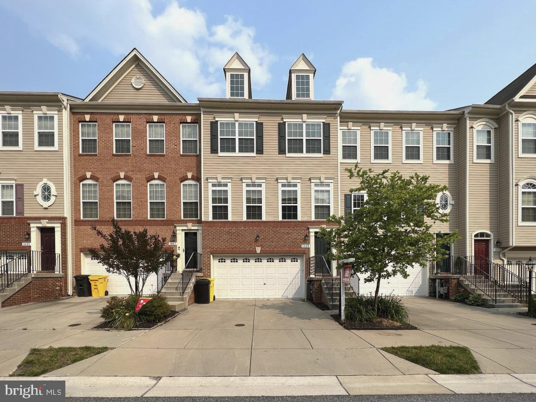 a front view of a building with many windows
