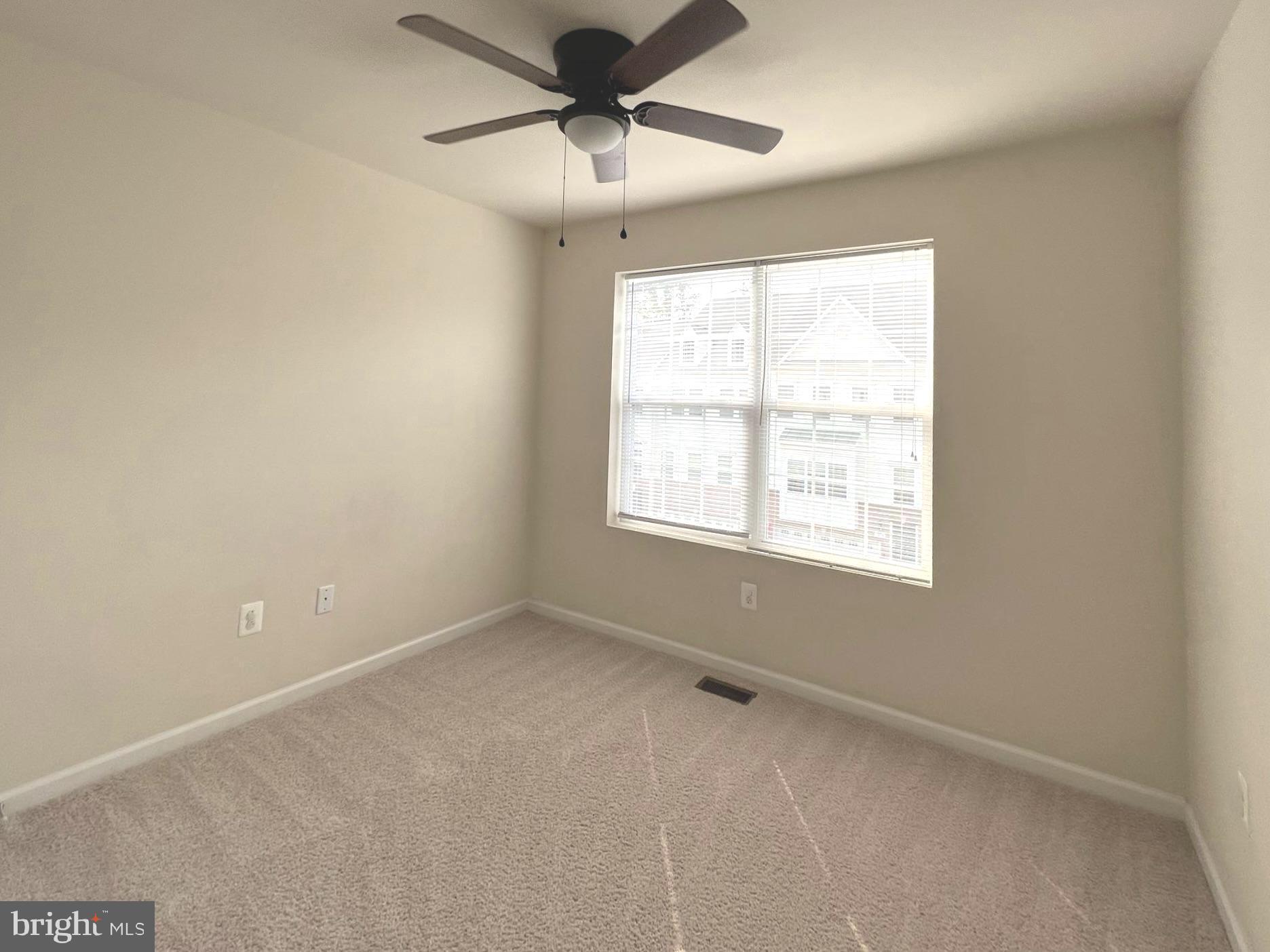 1009 Red Clover Road Gambrills, MD 21054 - Photo 13 of 21 an empty room with a window and a fan