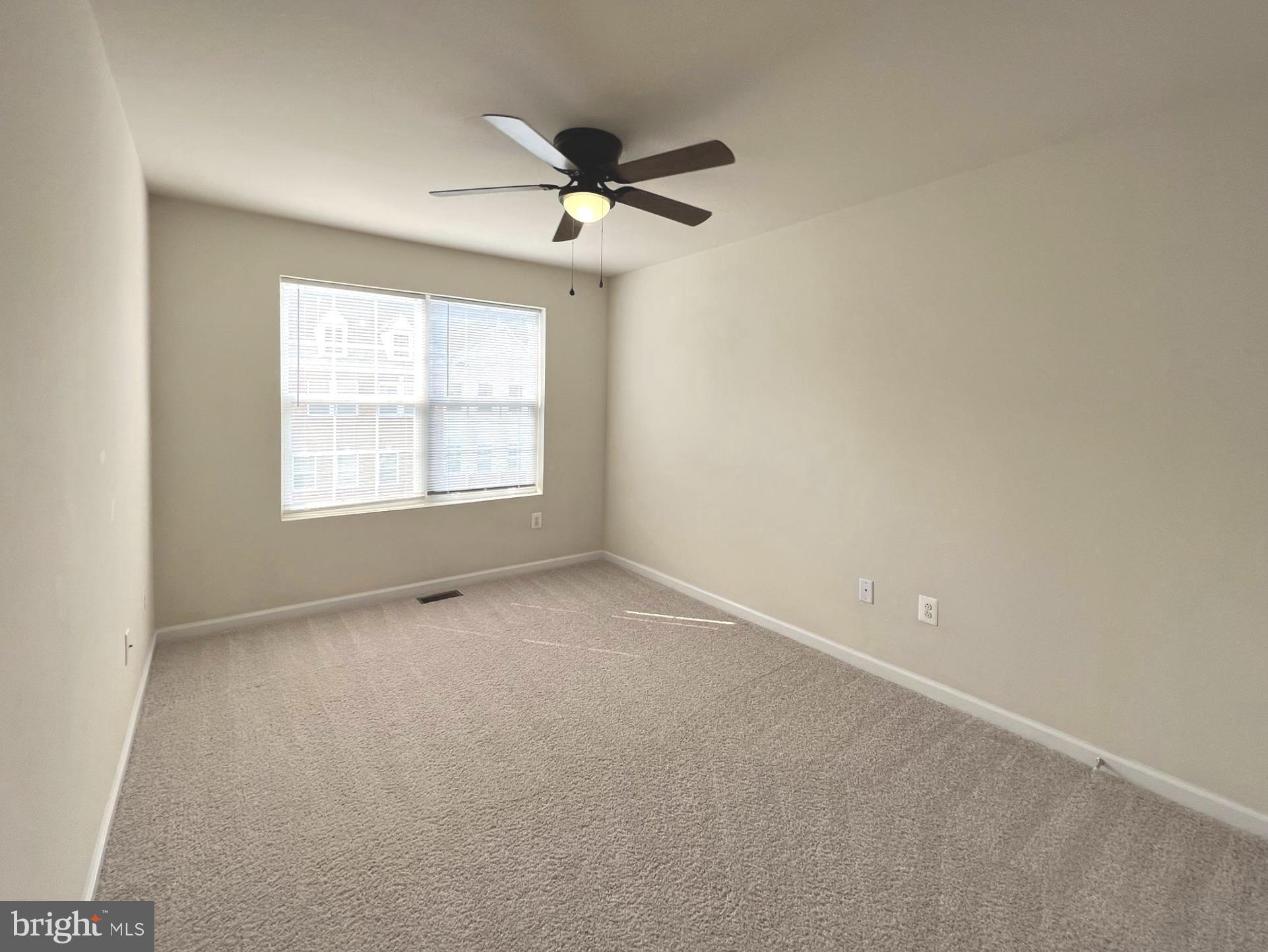 1009 Red Clover Road Gambrills, MD 21054 - Photo 14 of 21 an empty room with a window and a fan