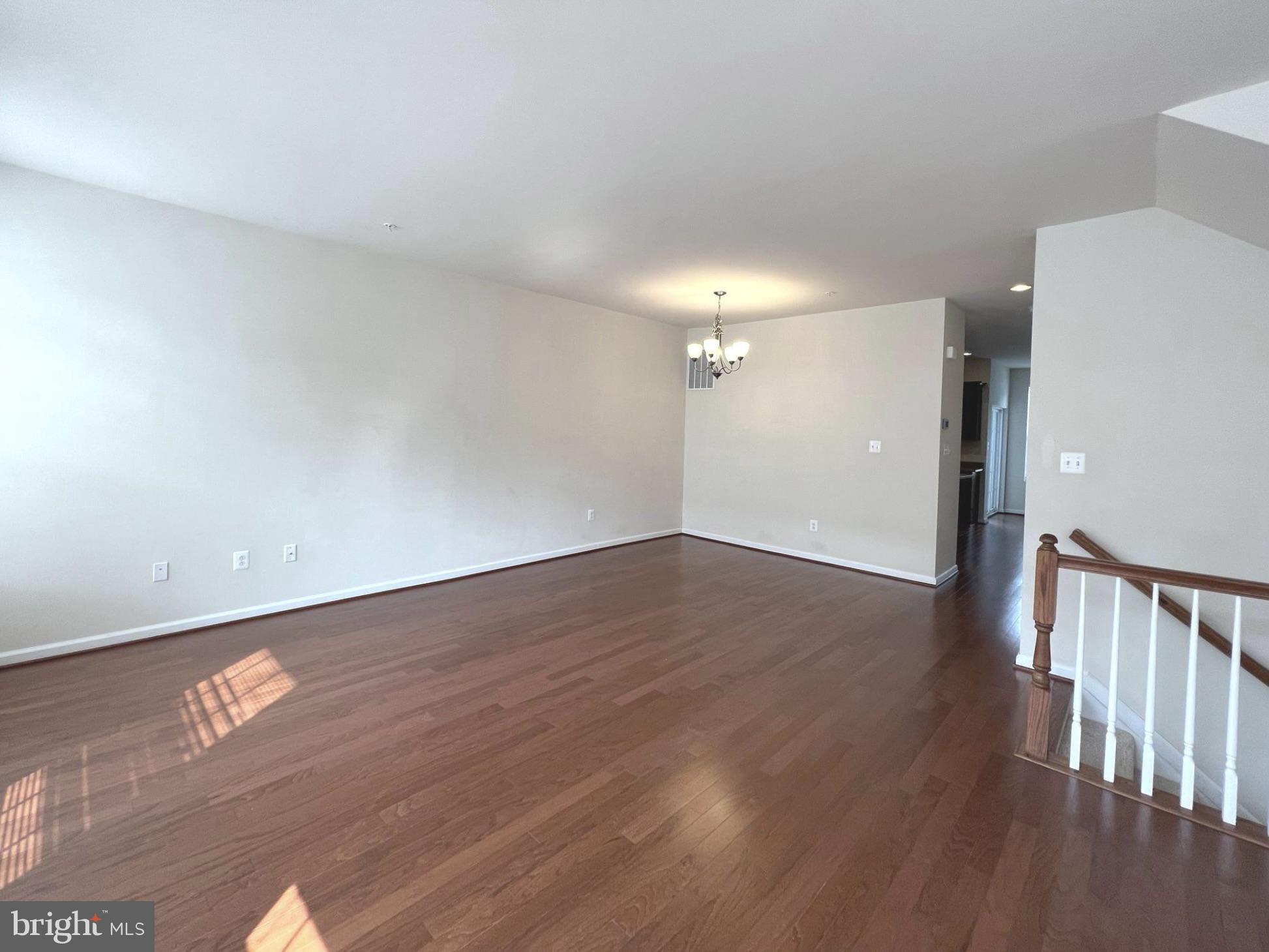 1009 Red Clover Road Gambrills, MD 21054 - Photo 3 of 21 a view of an empty room with wooden floor
