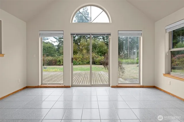 a bathroom with a toilet sink vanity and mirror
