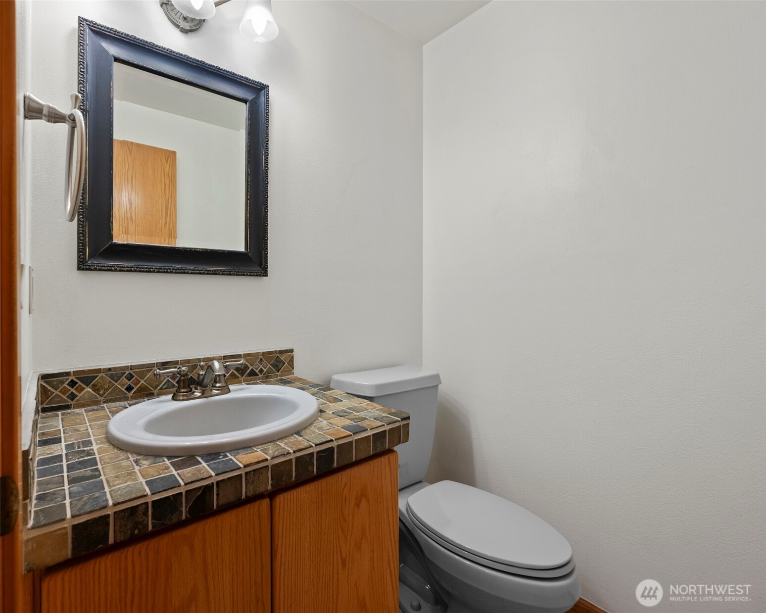2049 Zylstra Road Oak Harbor, WA 98277 - Photo 15 of 36 a bathroom with a toilet sink vanity and mirror