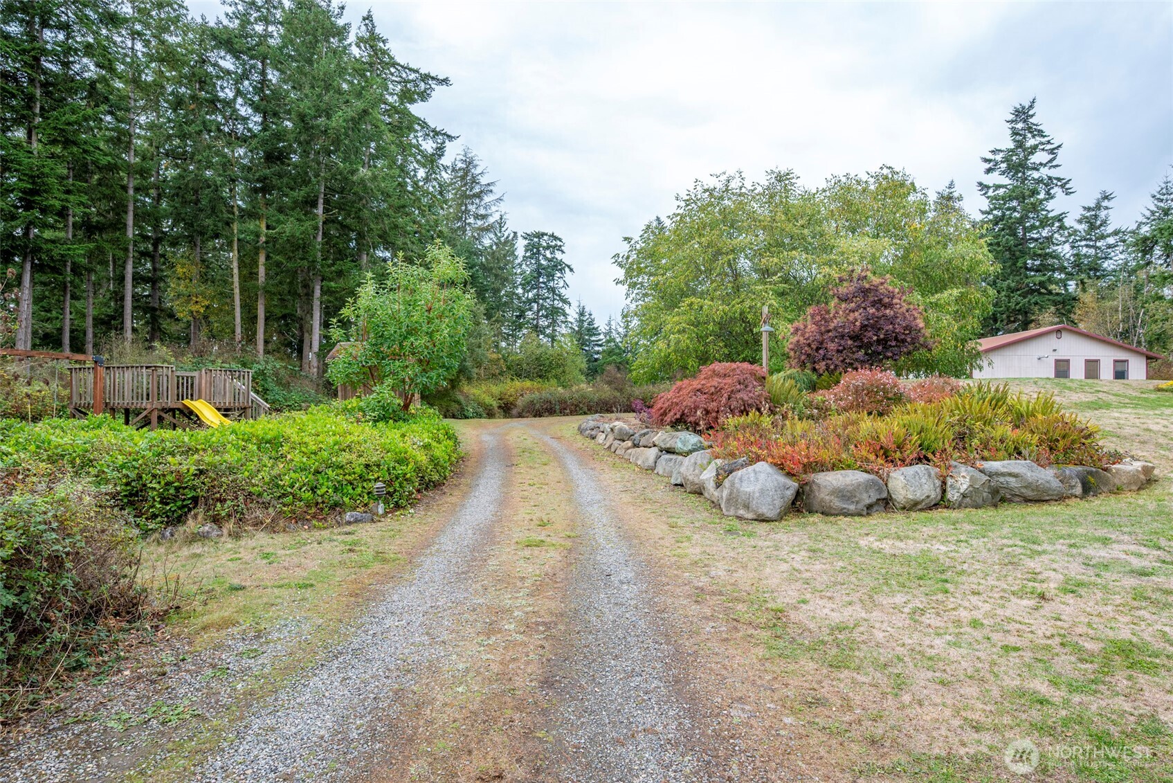 2049 Zylstra Road Oak Harbor, WA 98277 - Photo 27 of 36 a view of a table and chairs in a garden
