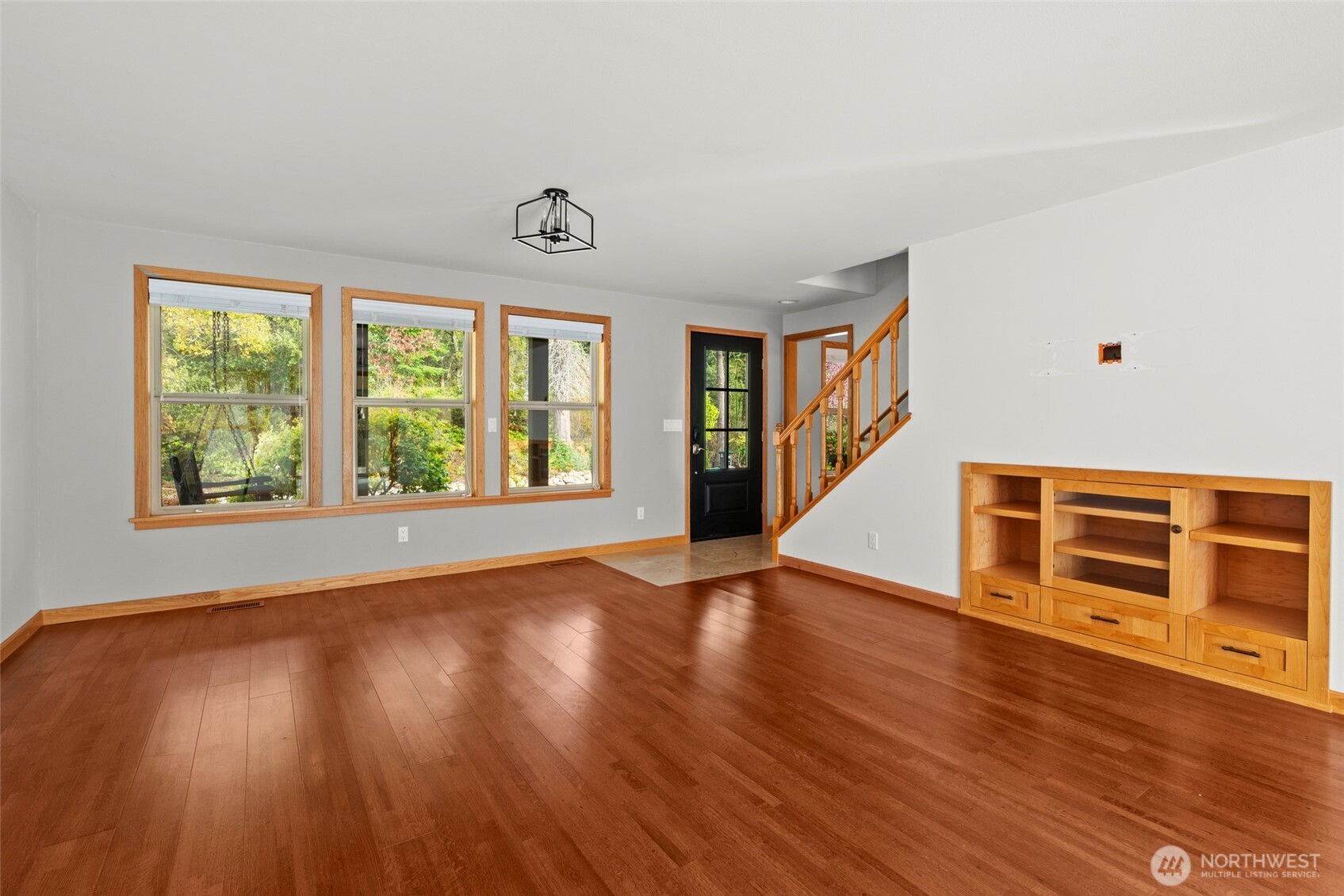 2049 Zylstra Road Oak Harbor, WA 98277 - Photo 8 of 36 an empty room with wooden floor and windows