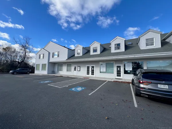a view of a car park in front of house