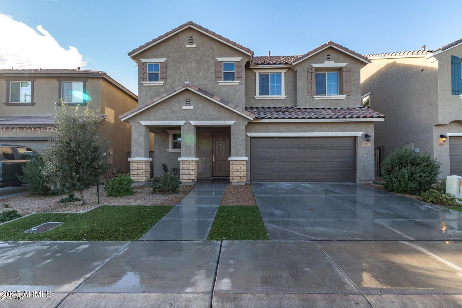 a front view of a house with yard
