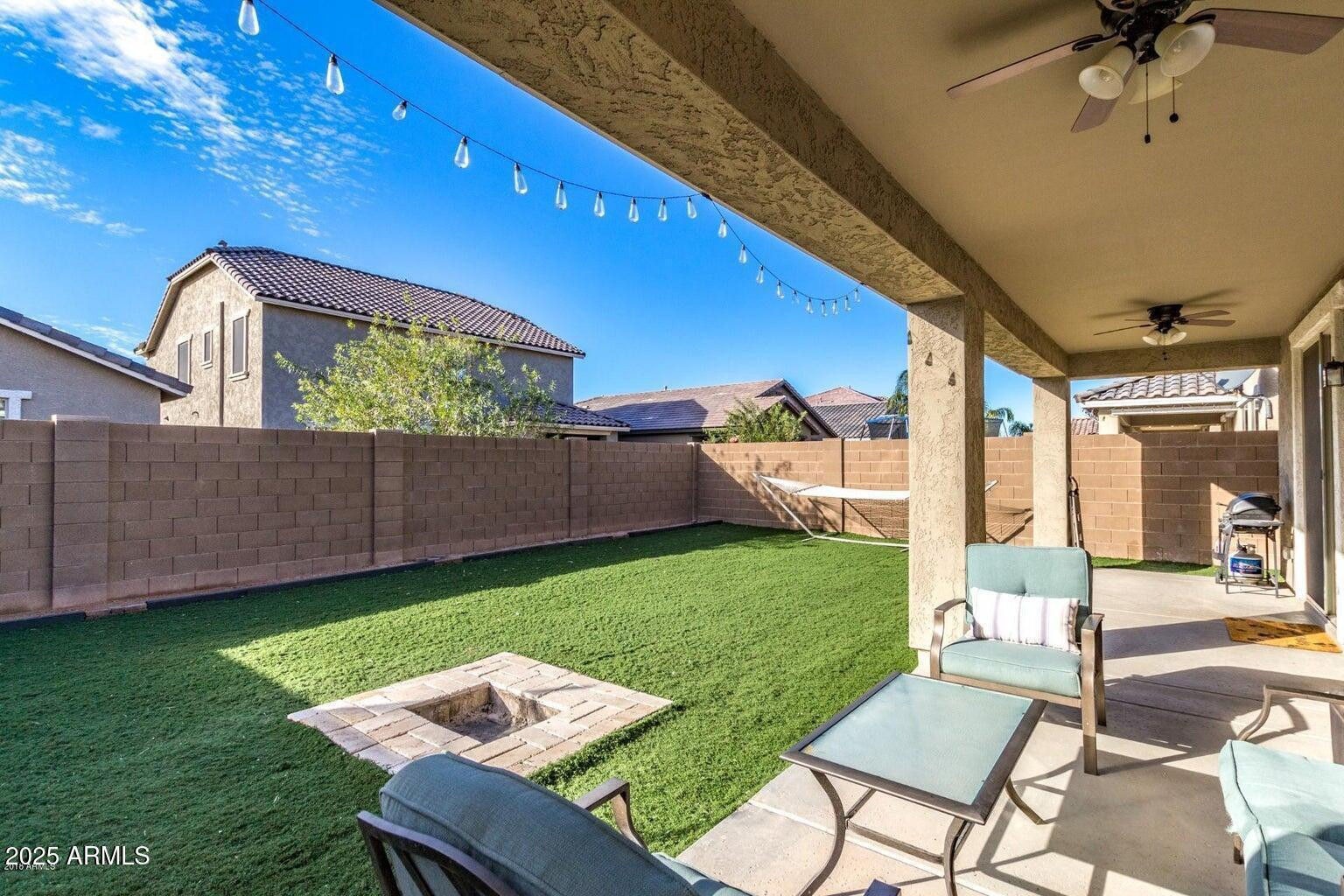 12057 West Rowel Road Peoria, AZ 85383 - Photo 19 of 20 a view of a backyard with furniture
