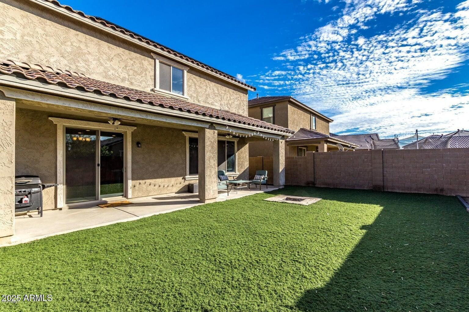 12057 West Rowel Road Peoria, AZ 85383 - Photo 20 of 20 a view of a house with a yard and sitting area