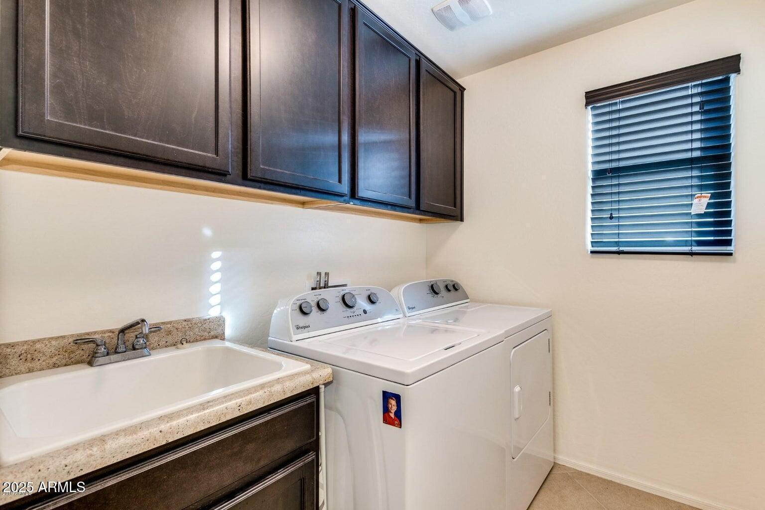 12057 West Rowel Road Peoria, AZ 85383 - Photo 9 of 20 a utility room with dryer and washer