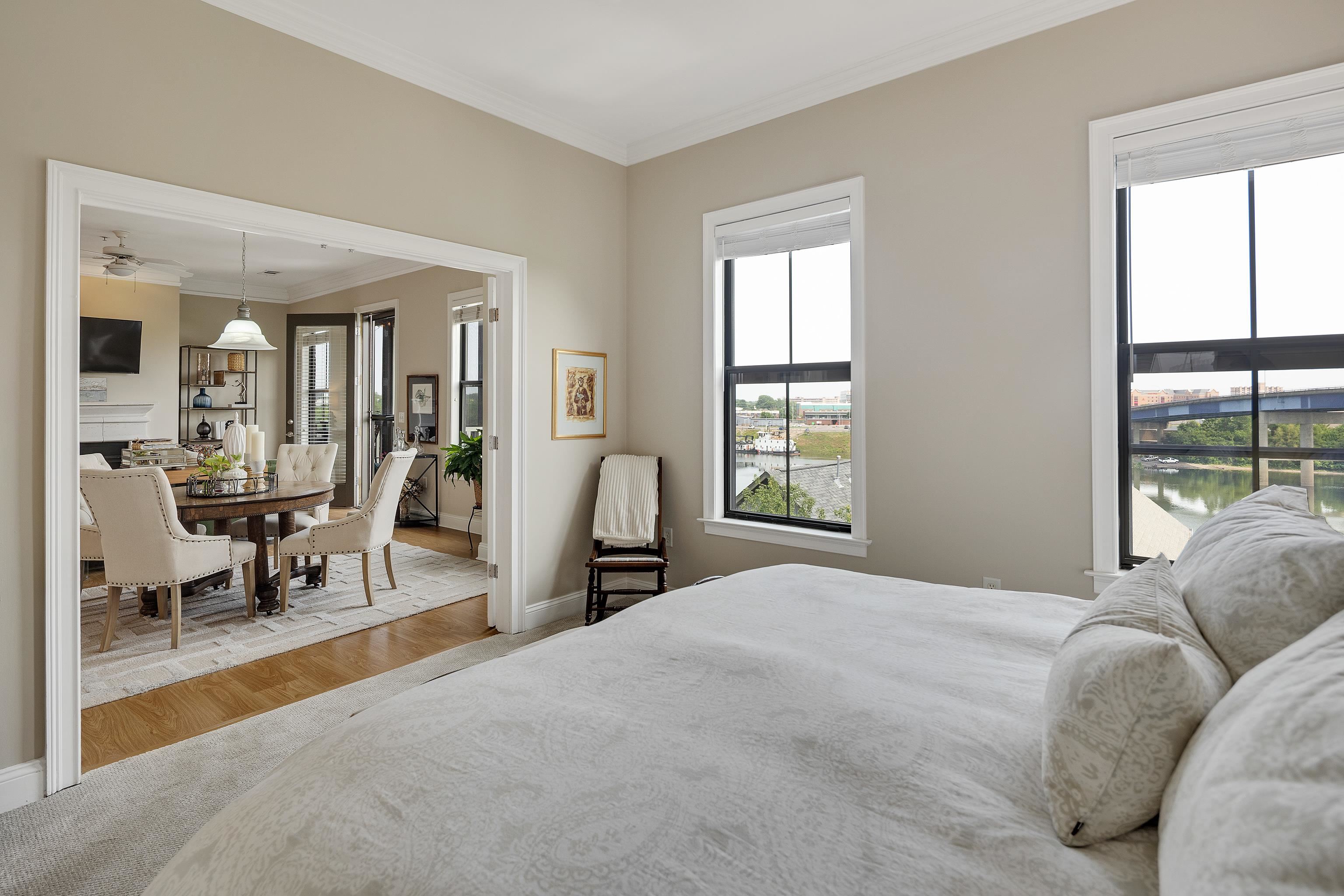 680 Harbor Bend Road, Unit 308 Memphis, TN 38103 - Photo 15 of 31 Bedroom featuring wood finished floors, crown molding, and a water view