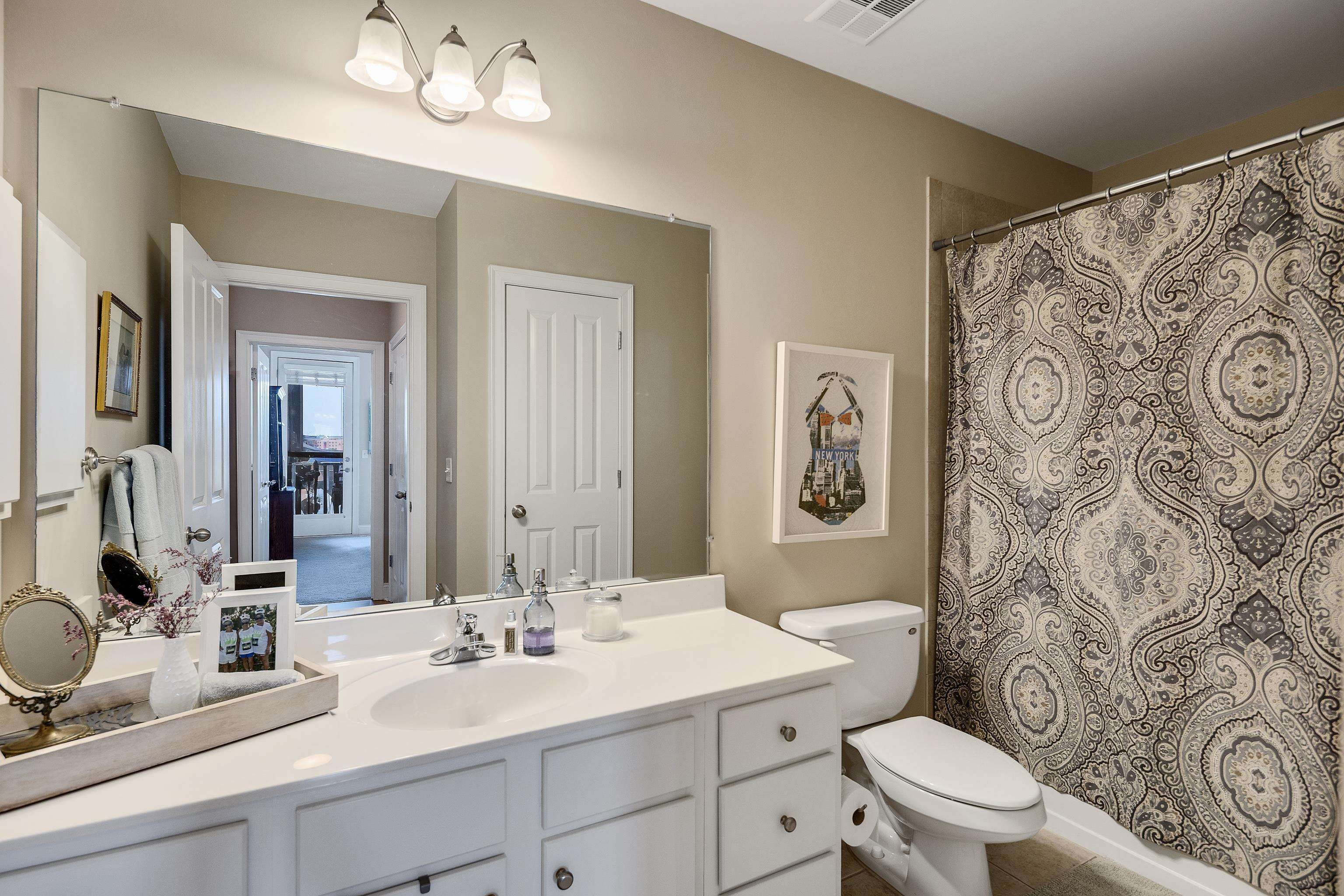 680 Harbor Bend Road, Unit 308 Memphis, TN 38103 - Photo 21 of 31 Bathroom featuring vanity, a shower with curtain, and tile patterned flooring