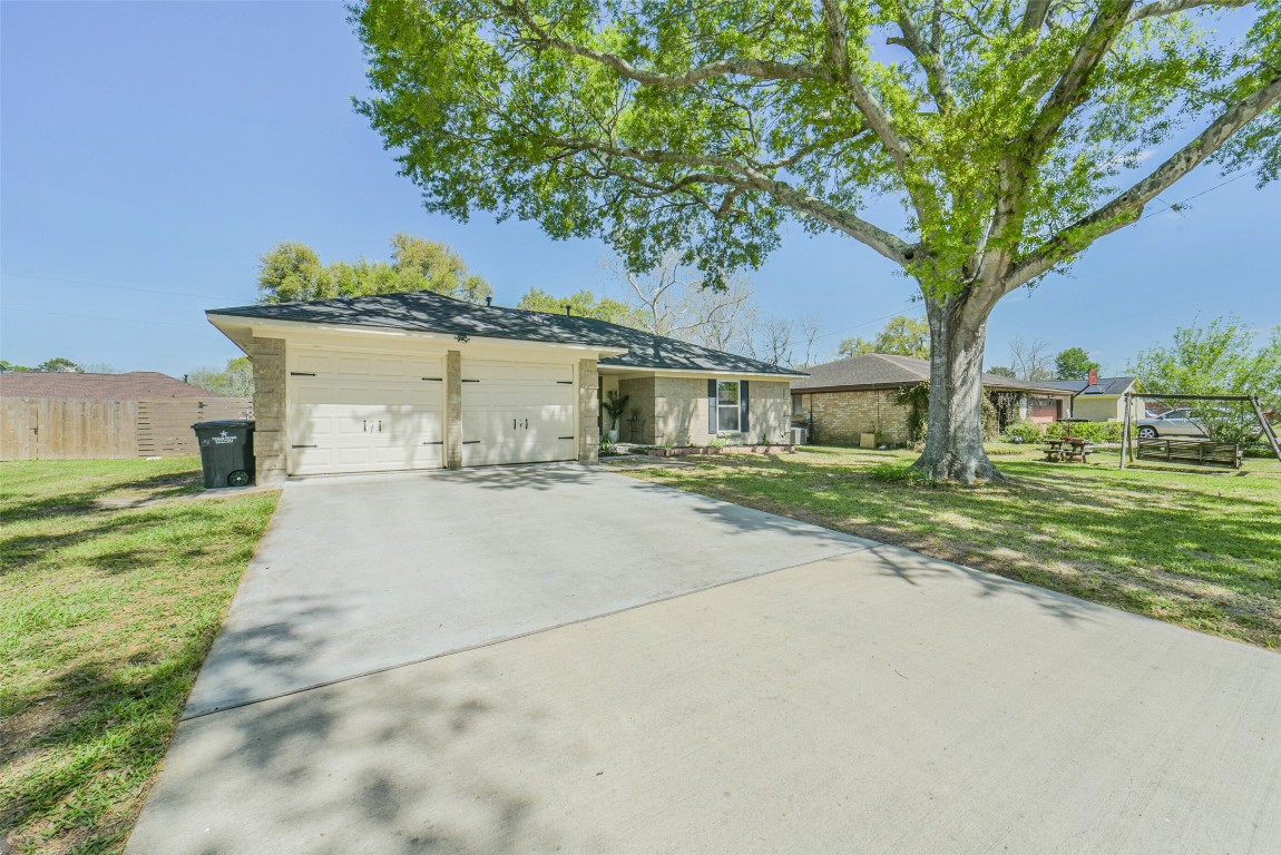 323 Coventry Lane Alvin, TX 77511 - Photo 2 of 37 a view of house with outdoor space and tree s