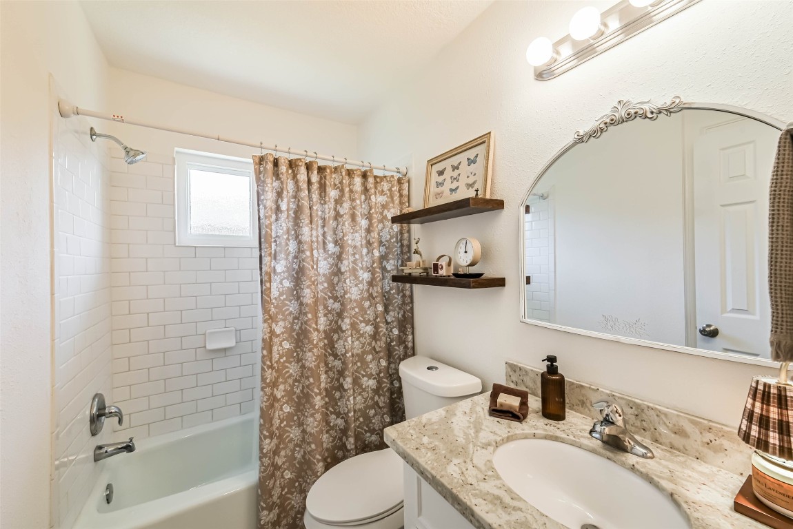 323 Coventry Lane Alvin, TX 77511 - Photo 29 of 37 a bathroom with a sink a toilet and shower