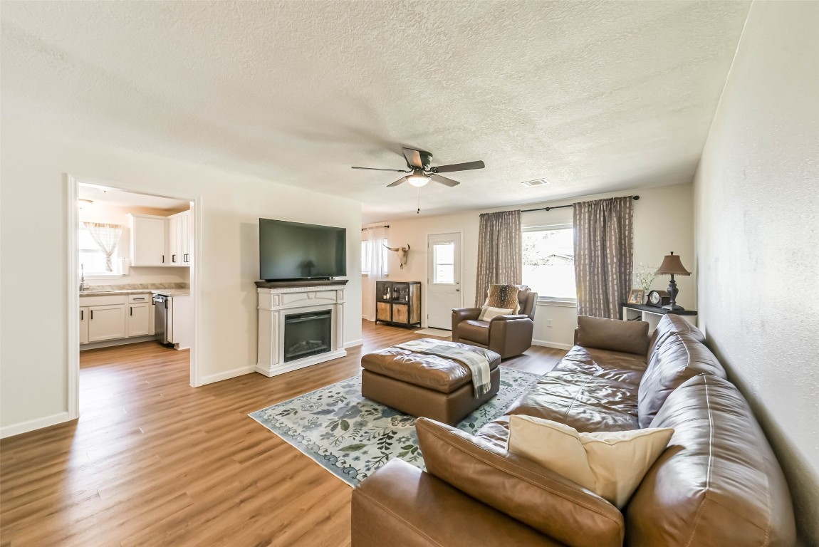 323 Coventry Lane Alvin, TX 77511 - Photo 6 of 37 a living room with furniture and a flat screen tv