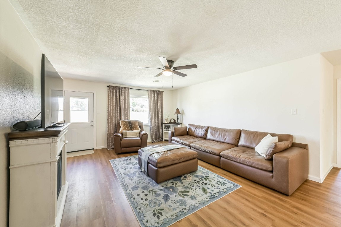 323 Coventry Lane Alvin, TX 77511 - Photo 7 of 37 a living room with furniture and a wooden floor