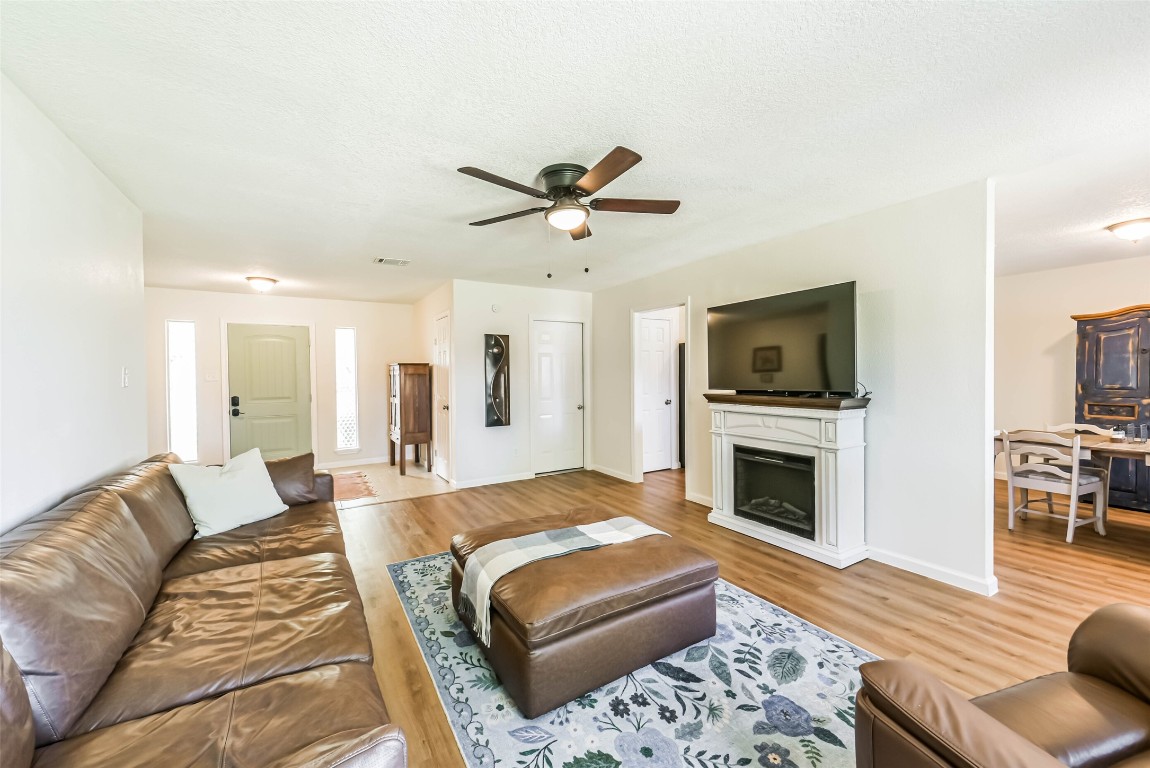 323 Coventry Lane Alvin, TX 77511 - Photo 8 of 37 a living room with furniture fireplace and flat screen tv