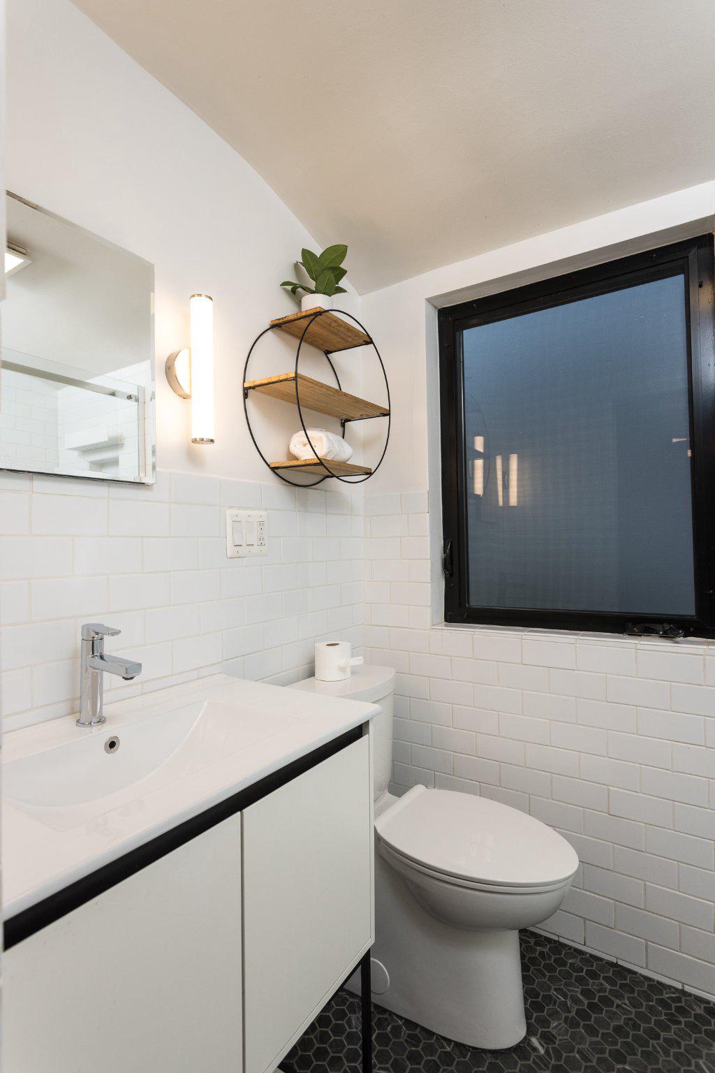 7006 Copeleigh Road Baltimore, MD 21212 - Photo 29 of 43 a bathroom with a sink and a mirror