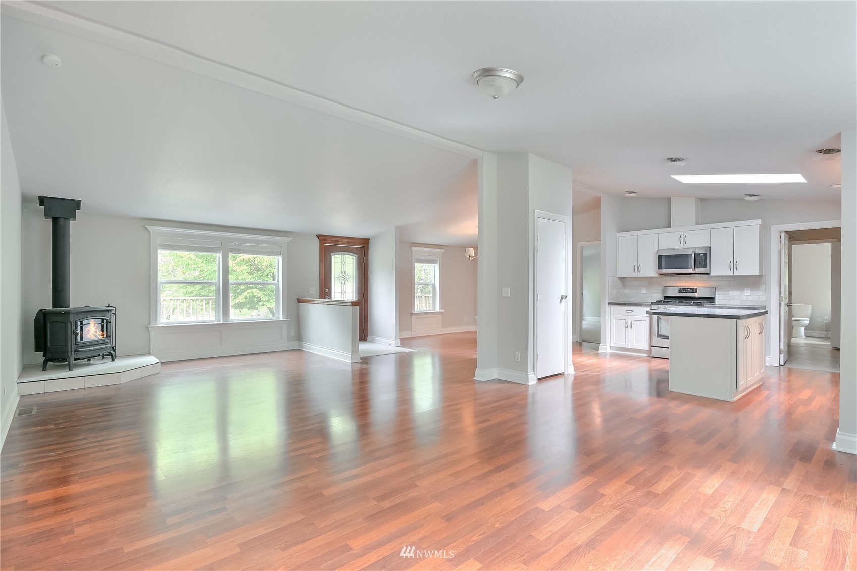 12319 Chain Lake Road Snohomish, WA 98290 - Photo 11 of 38 a view of kitchen with cabinets and wooden floor