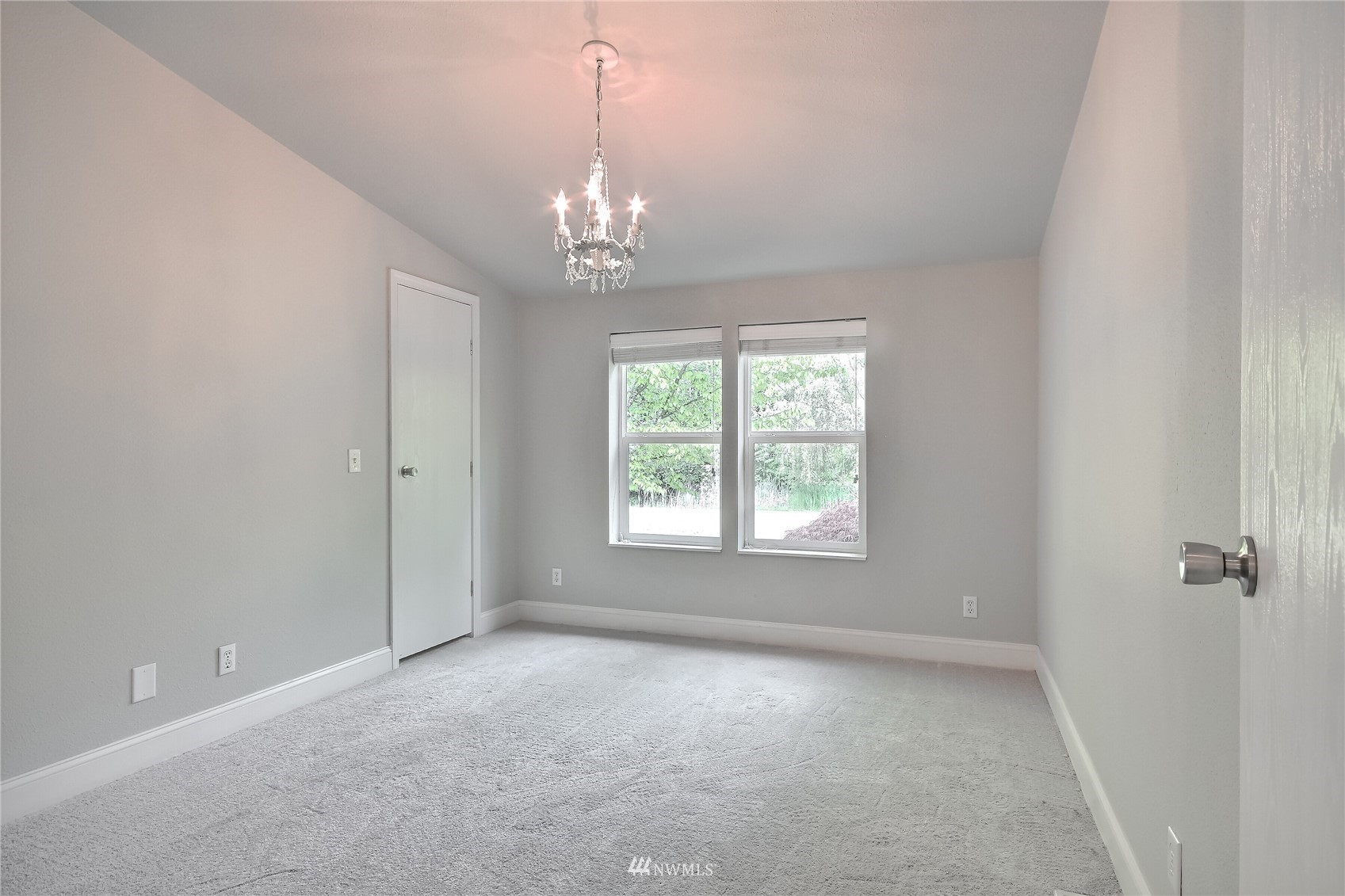12319 Chain Lake Road Snohomish, WA 98290 - Photo 18 of 38 a view of a chandelier and a chandelier in big room
