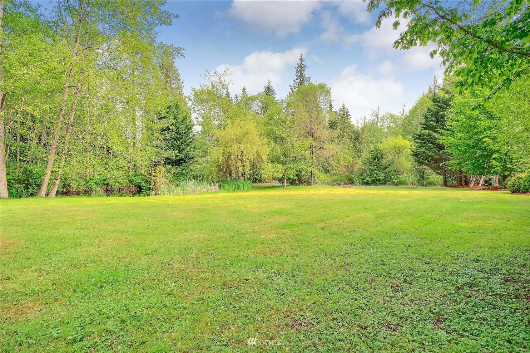 12319 Chain Lake Road Snohomish, WA 98290 - Photo 27 of 38 a view of a yard with a house
