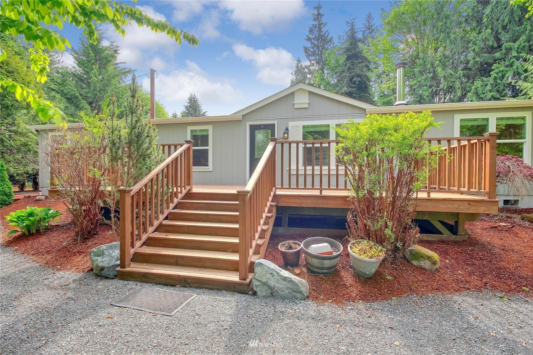 12319 Chain Lake Road Snohomish, WA 98290 - Photo 3 of 38 a view of backyard with deck and outdoor seating