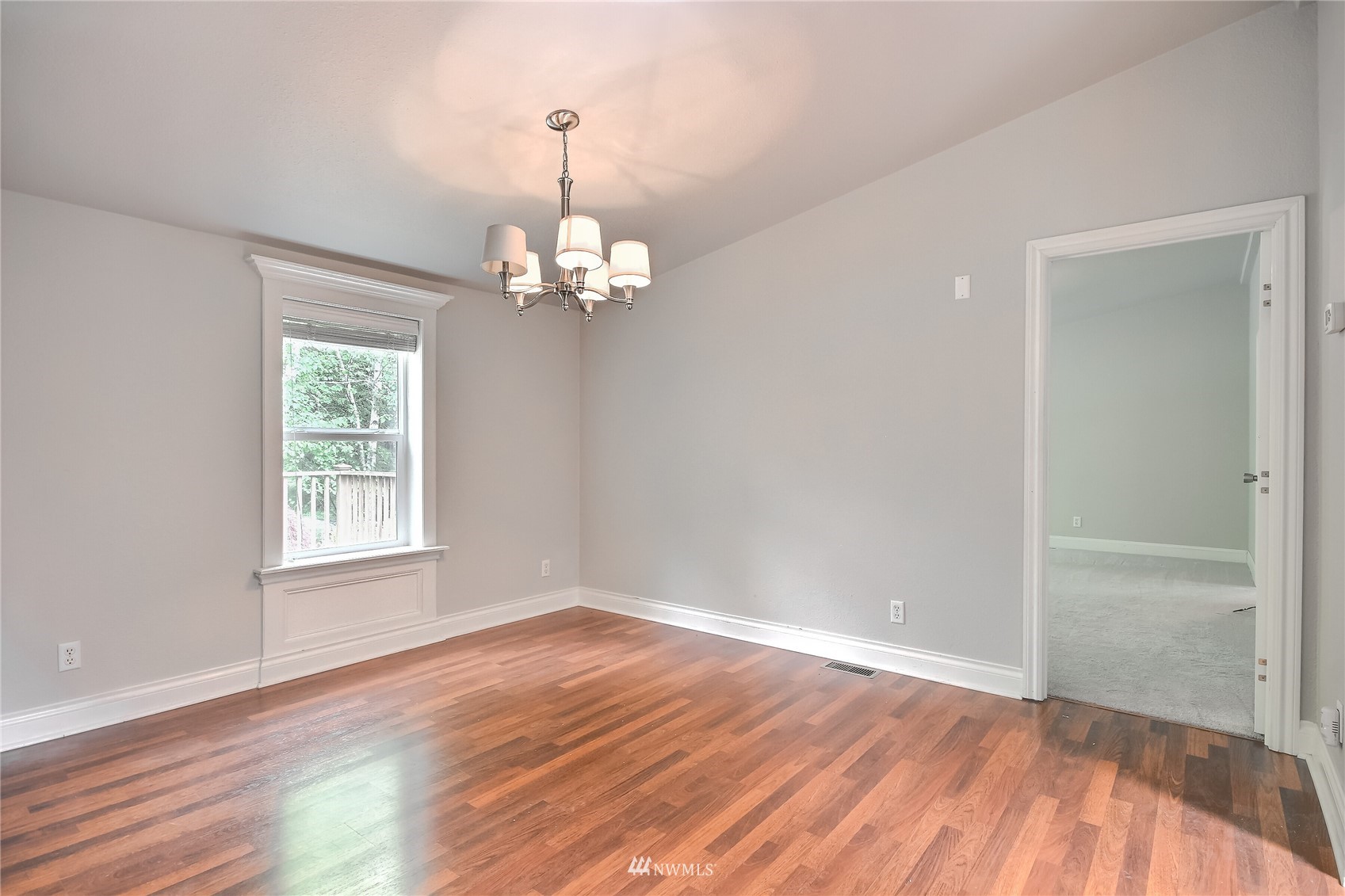 12319 Chain Lake Road Snohomish, WA 98290 - Photo 8 of 38 wooden floor in an empty room with a window
