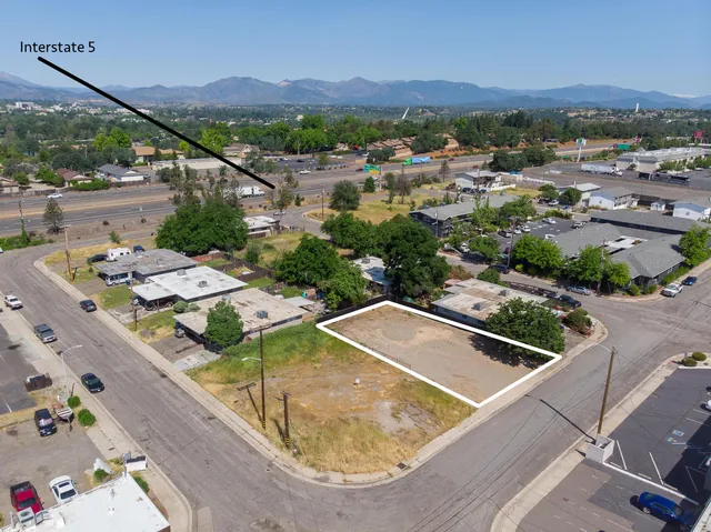 an aerial view of residential houses and outdoor space