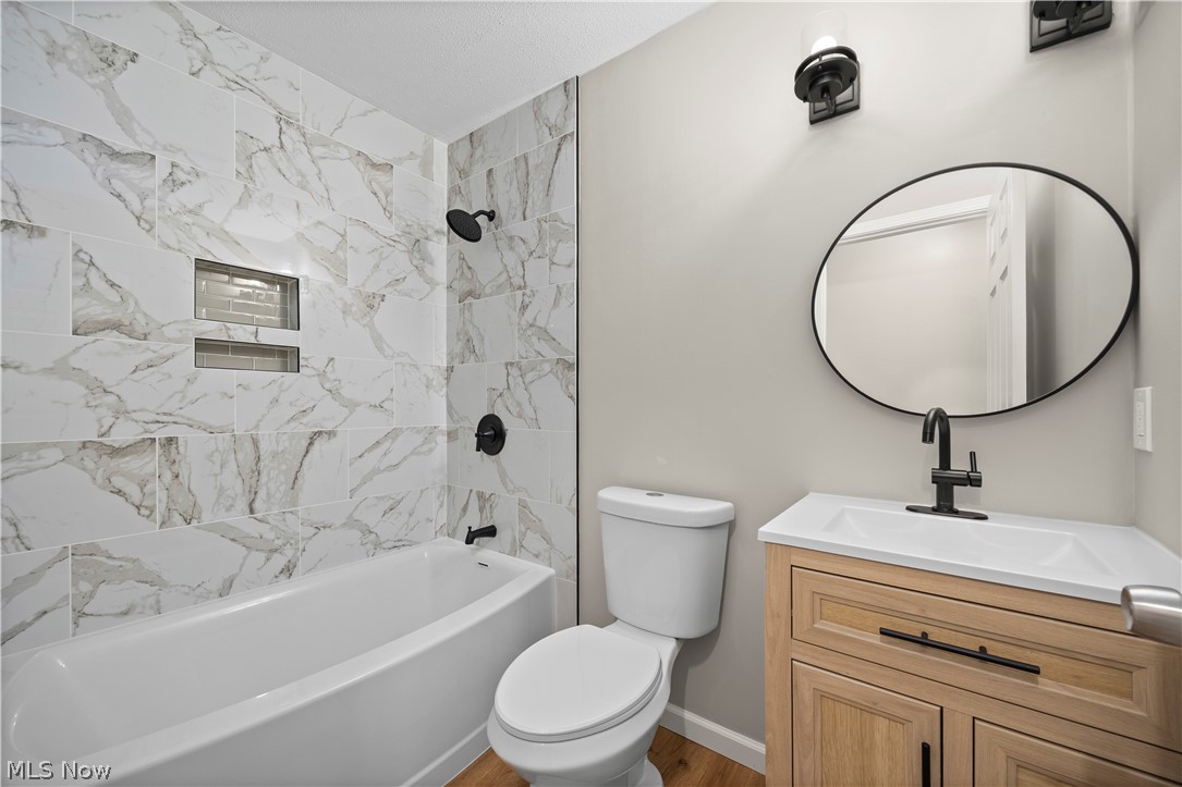36220 Neff Road Grafton, OH 44044 - Photo 24 of 50 Bathroom featuring vanity and shower / bath combination