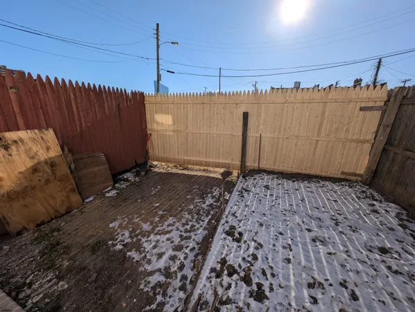 a view of a house with a small yard