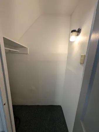a kitchen with granite countertop a refrigerator stove and sink
